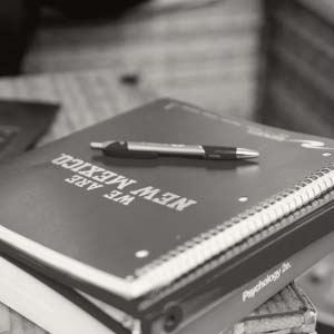 UNM notebook with pen sitting on top